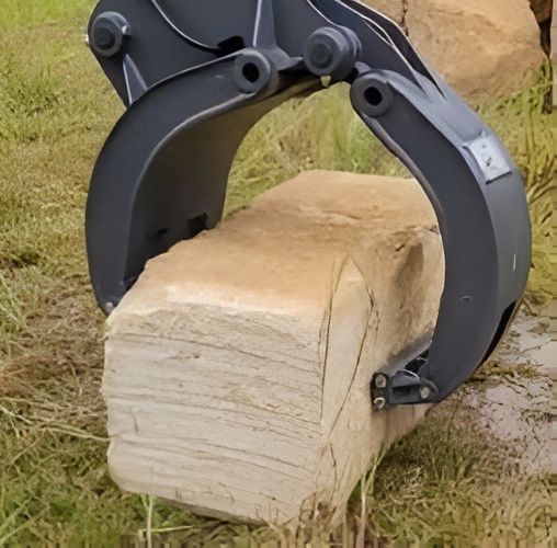 Excavator Claw Gripping a Rectangular Sandstone — Allquip Rentals Pty Ltd in Cooroy, QLD