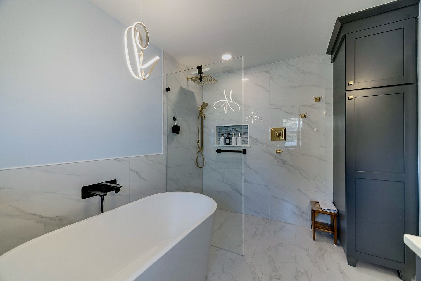 A bathroom with a bathtub and a walk in shower