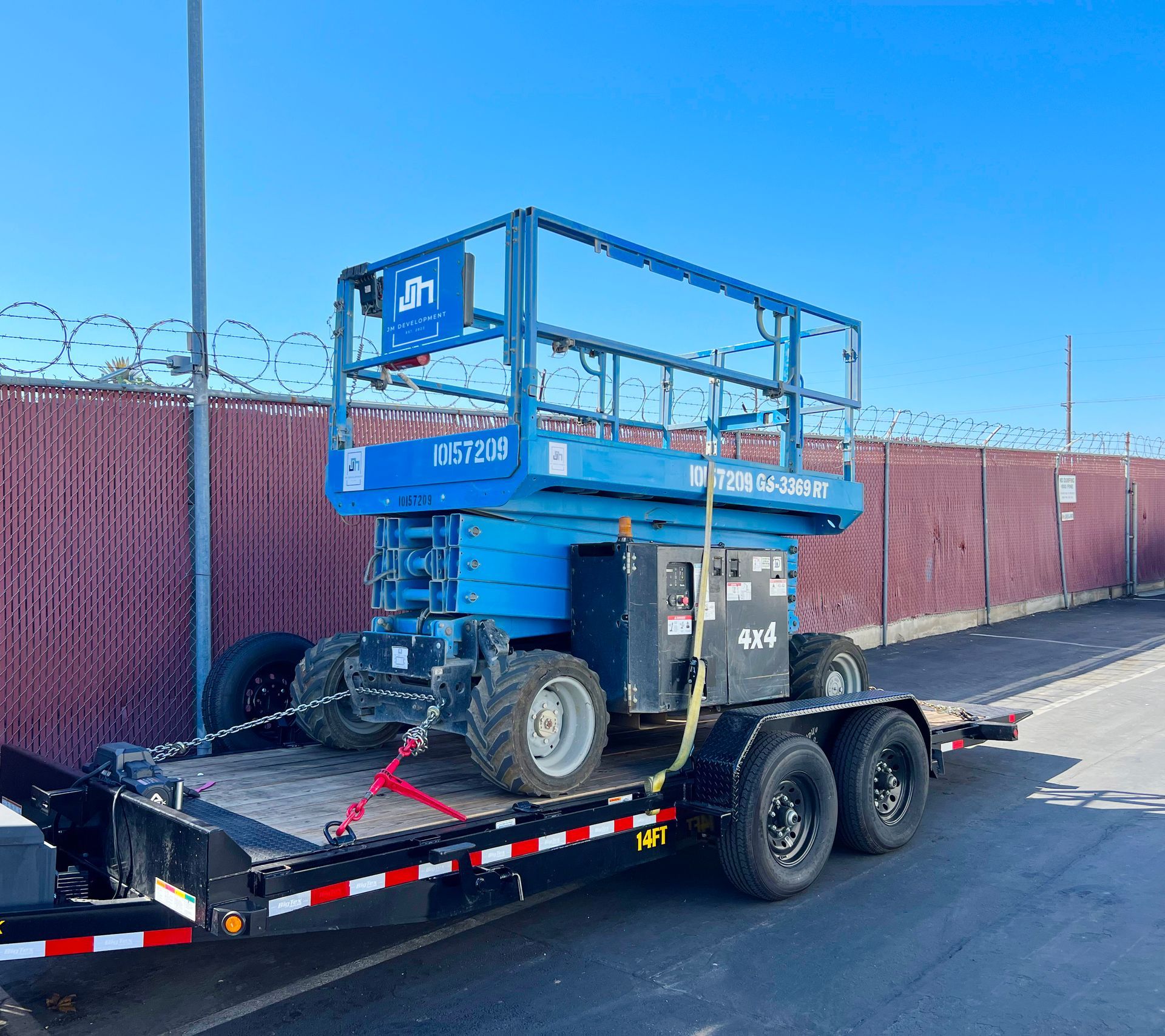 Scissor lift rental equipment on-site at a Southern California job site by JM Development
