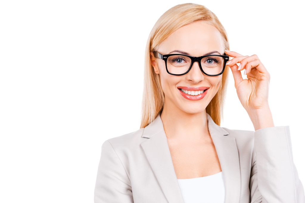 A woman wearing glasses and a suit is smiling.