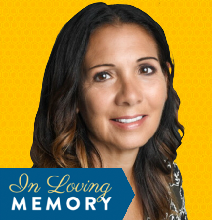 Kathy with brown hair smiles,