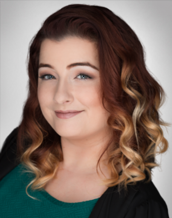 Stephanie Hertel is wearing a green shirt and a black jacket | Best Mortgage Lender in Roseville, CA