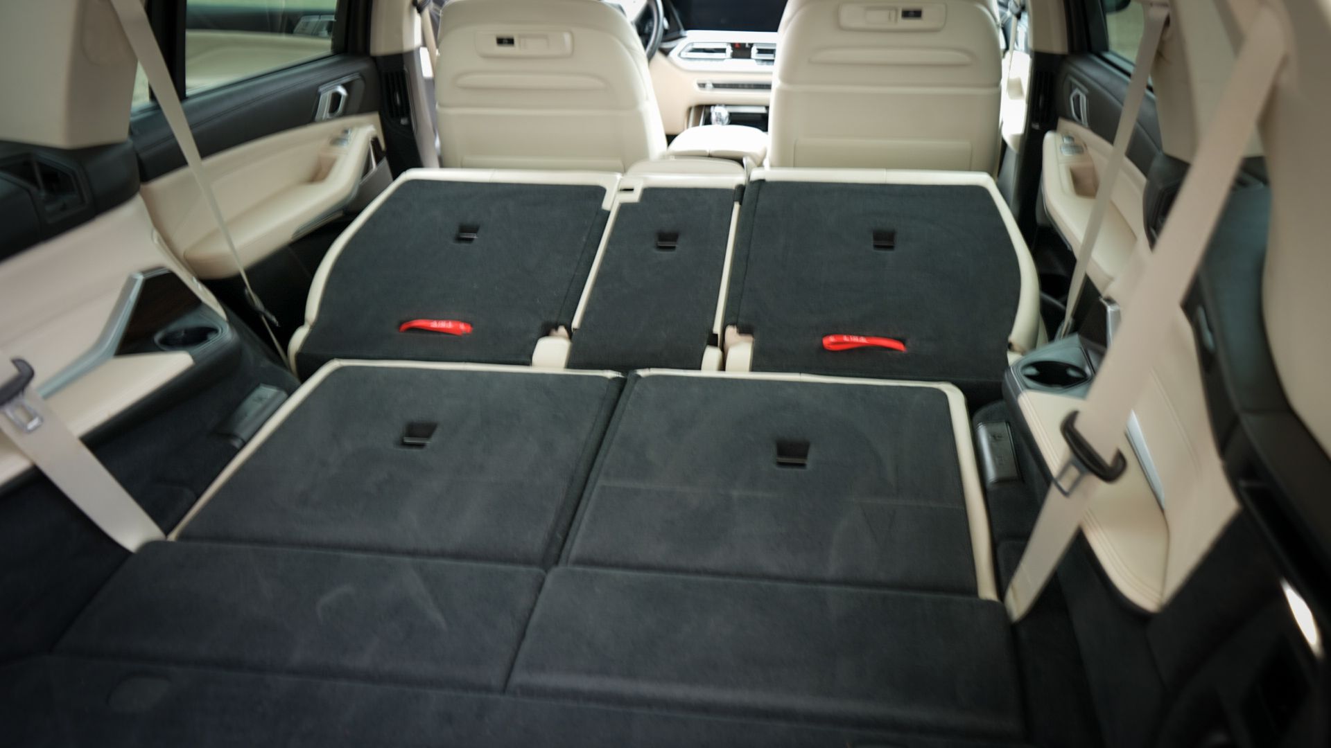 The back seat of a car with the trunk open