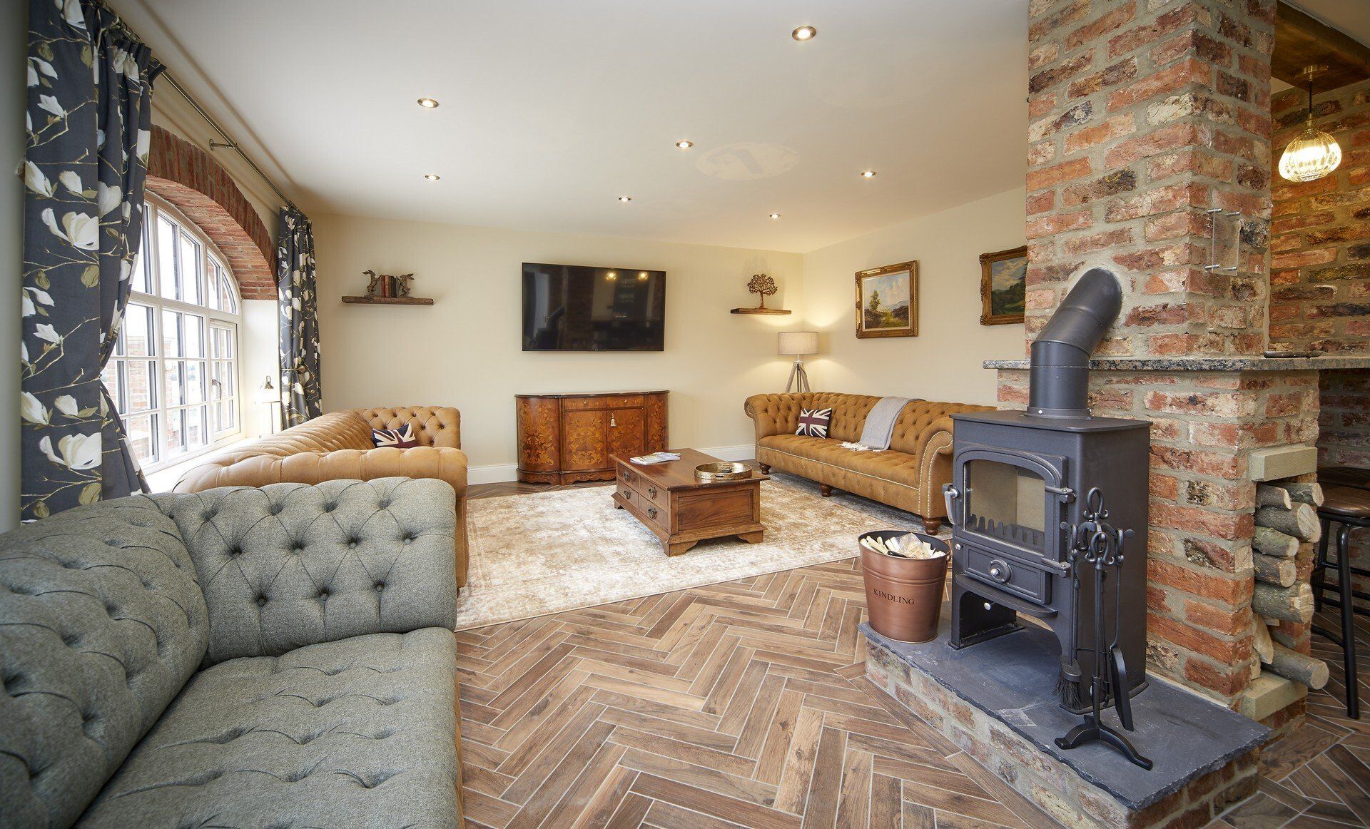 A living room with a fireplace and a couch