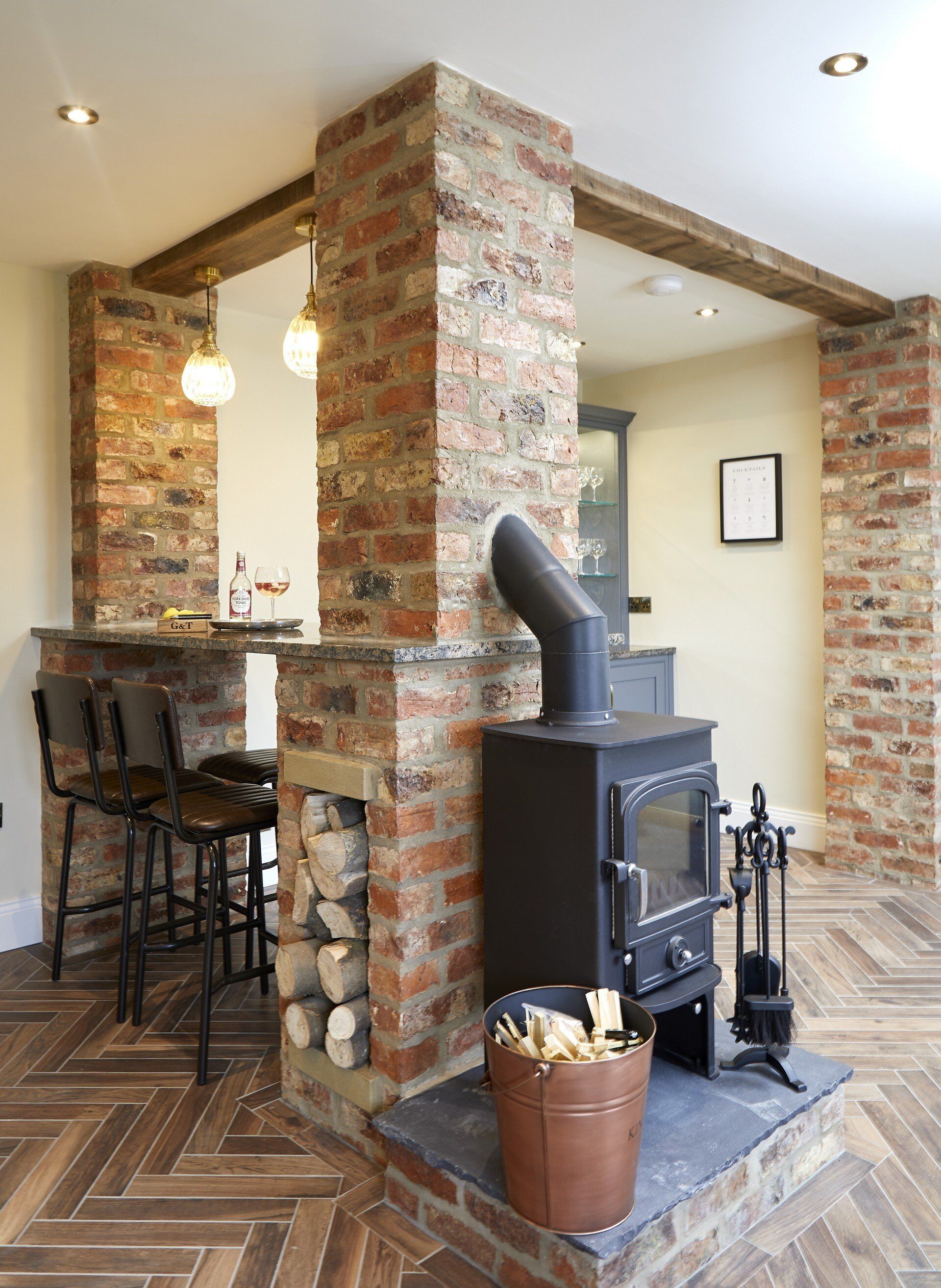 There is a wood stove in the middle of the room.