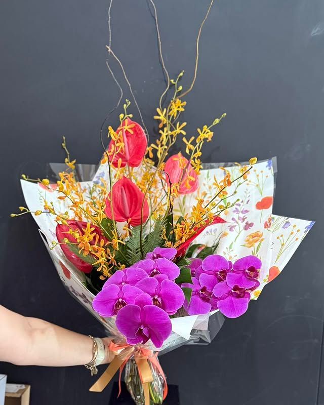 Bouquet of Red Anthuriums and Purple Orchids Wrapped — J'adore Flowers & Gifts Cairns in Earlville, QLD