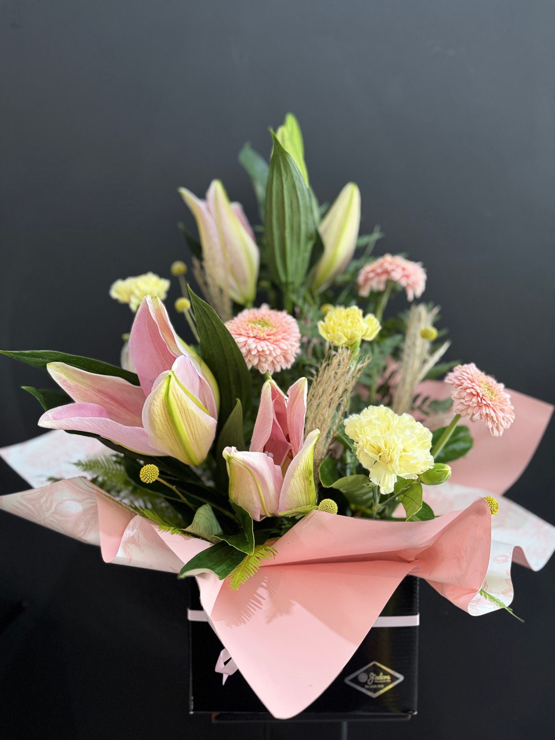 Pink and Yellow Floral Arrangement in a Black Box, With Pink Tissue Paper — J'adore Flowers & Gifts Cairns in Earlville, QLD