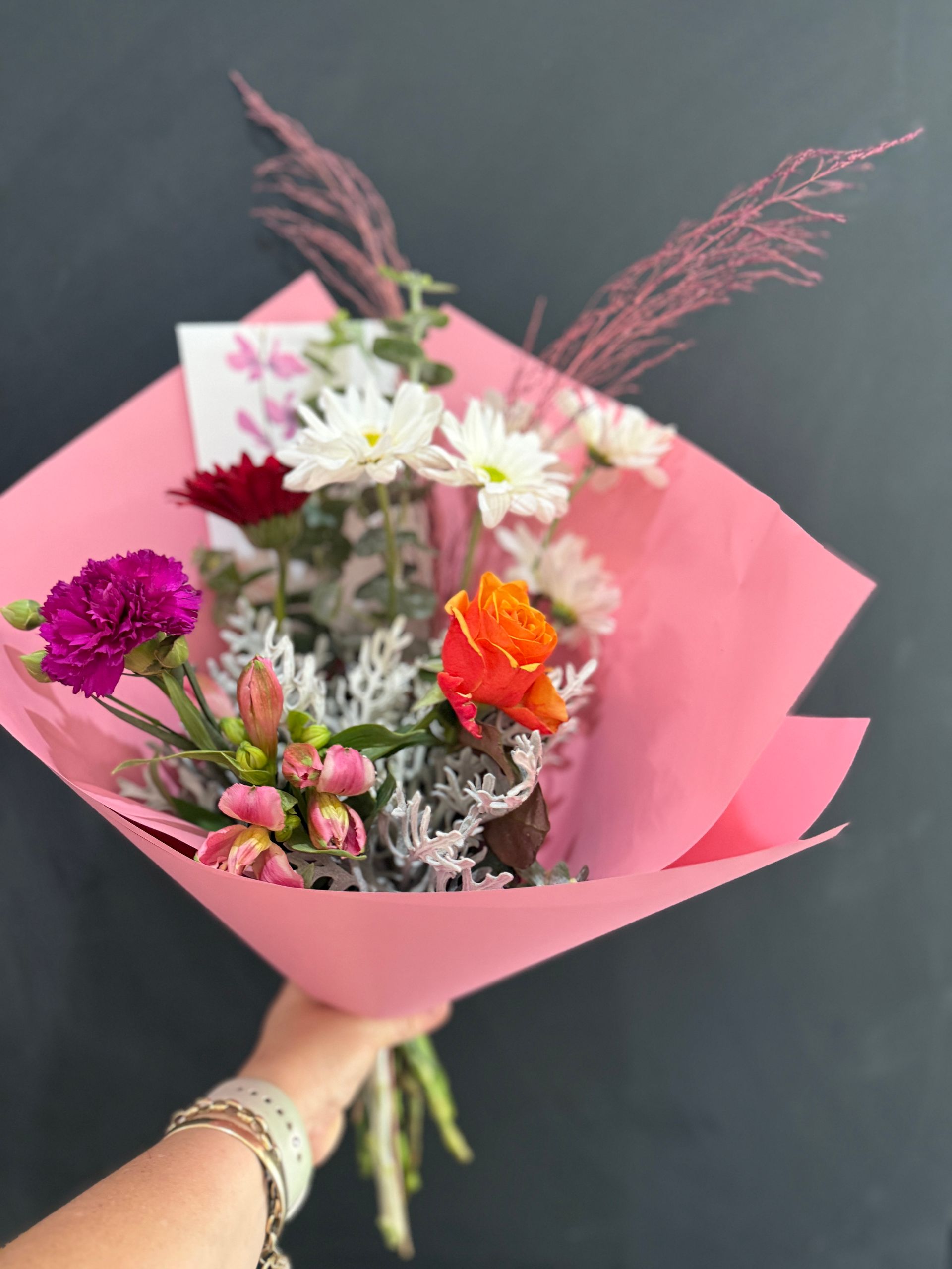 Floral arrangement of red roses and exotic blooms in a gold box -J'adore Flowers & Gifts Cairns in Earlville, QLD