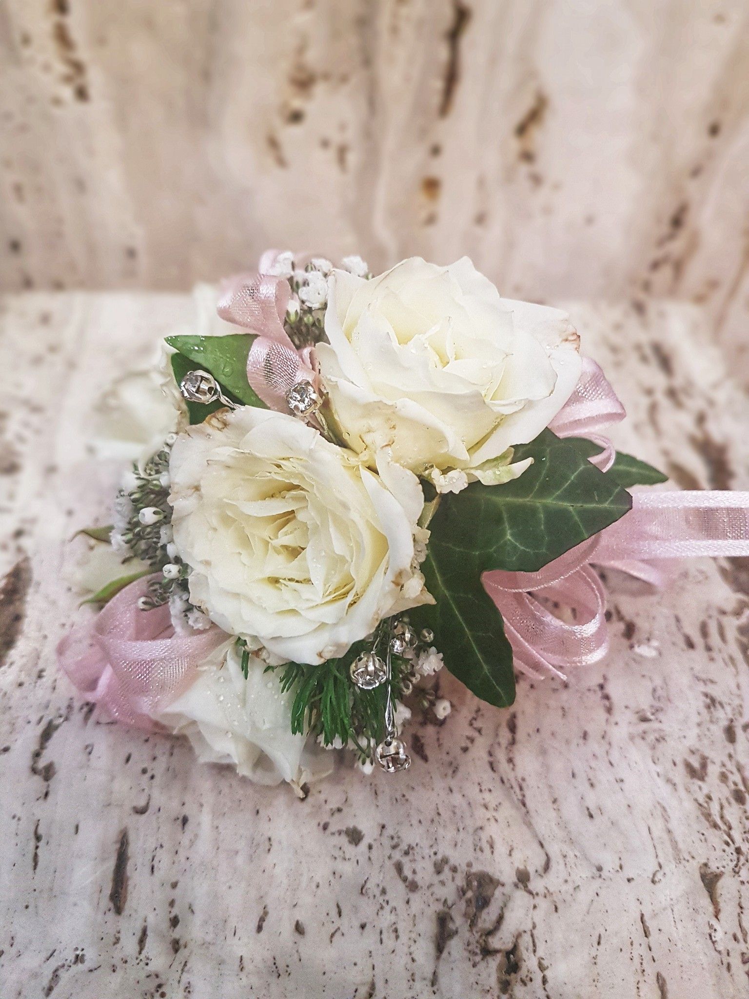 Wrist Corsage With White Roses, Pink Ribbon, and Greenery — J'adore Flowers & Gifts Cairns in Edge Hill, QLD