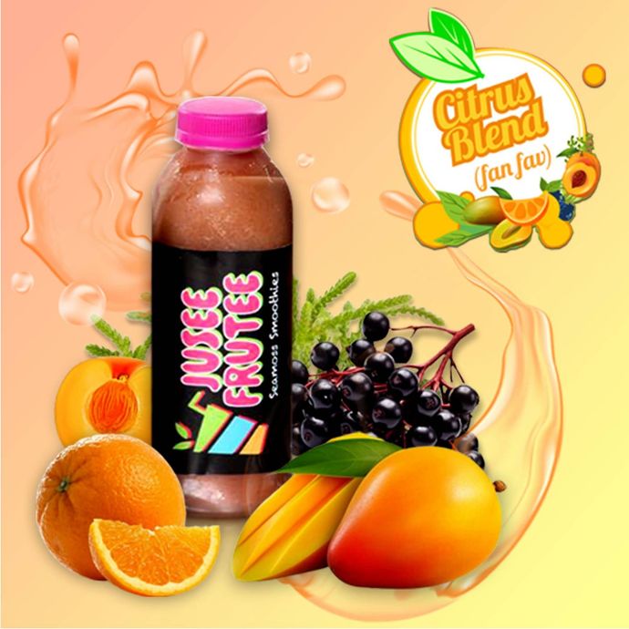 A bottle of citrus blend juice surrounded by fruit