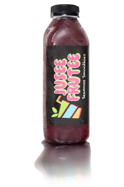 A bottle of juice fruites is sitting on a white surface.