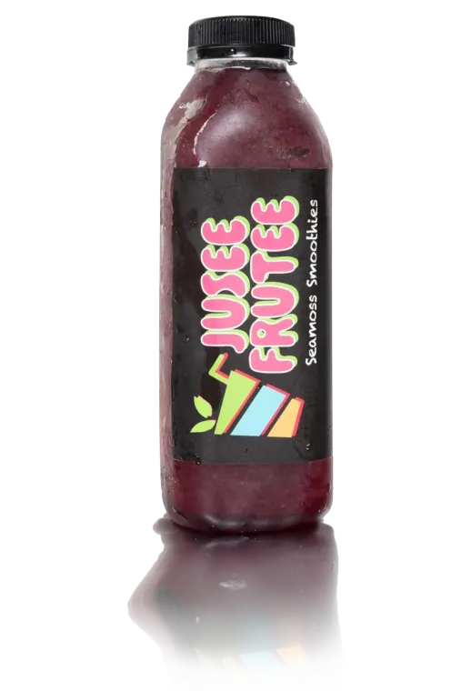 A bottle of juice fruites is sitting on a white surface.