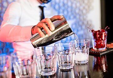 Bartender Mixing Drinks — Restaurant Equipment & Supplies in Daytona Beach, FL