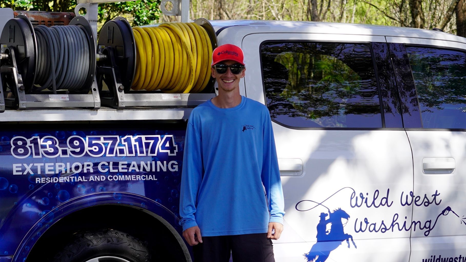A man standing in front of a wild west washing van