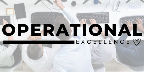 A group of people are sitting at desks using computers.