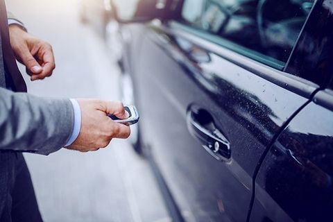 Man Unlocking Car Using Key Fobs — Pine Bluff, AR — Ace Lock and Key Service