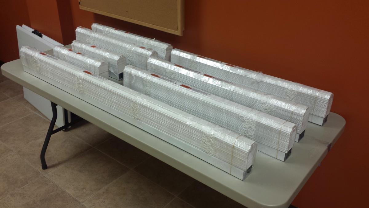 A table with a bunch of white boxes on it
