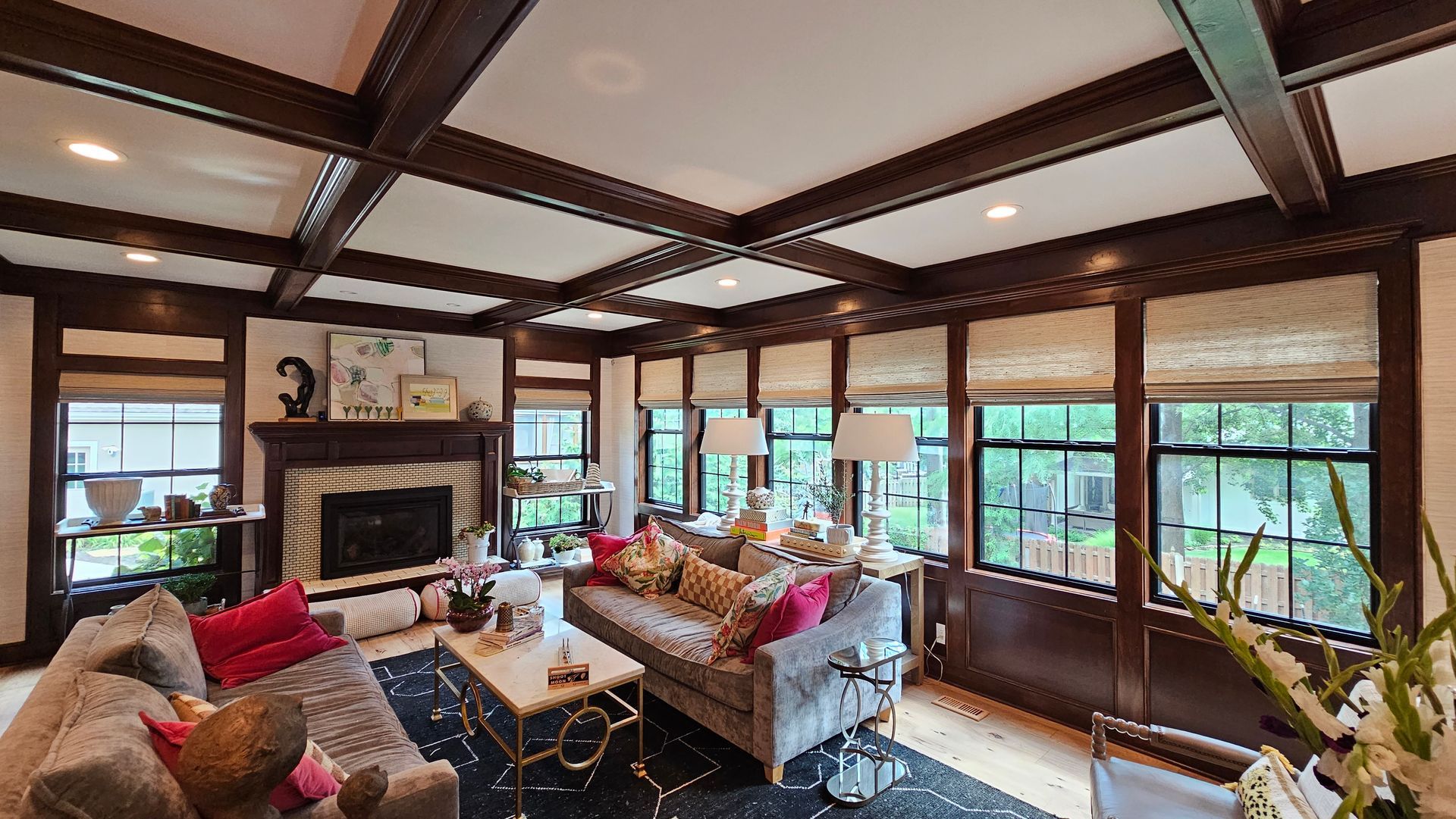 A living room filled with furniture and a fireplace.