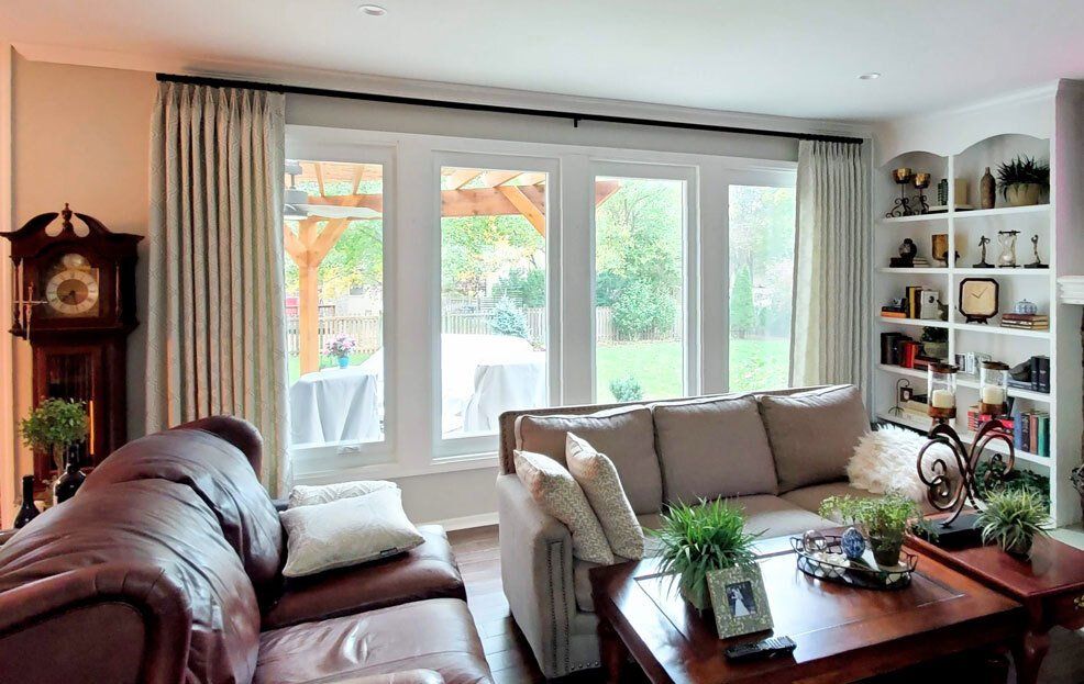 A living room filled with furniture and a clock.