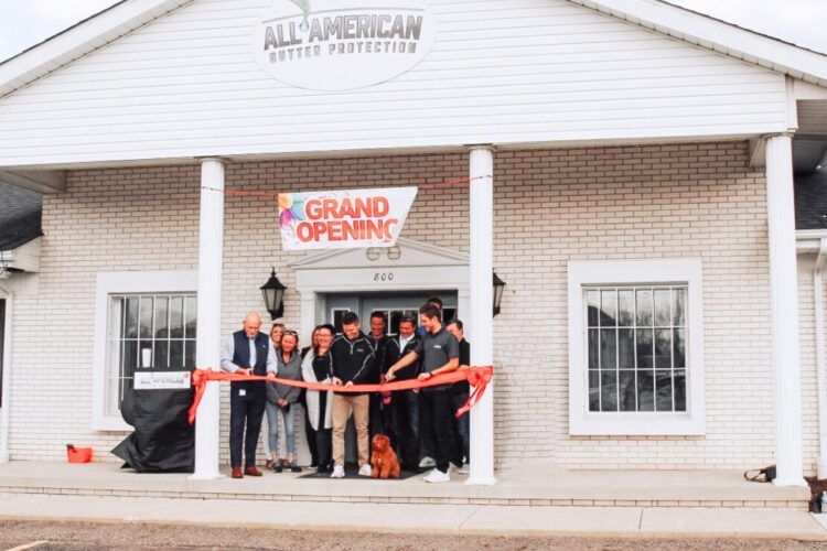 A group of people are posing for a picture in a building.