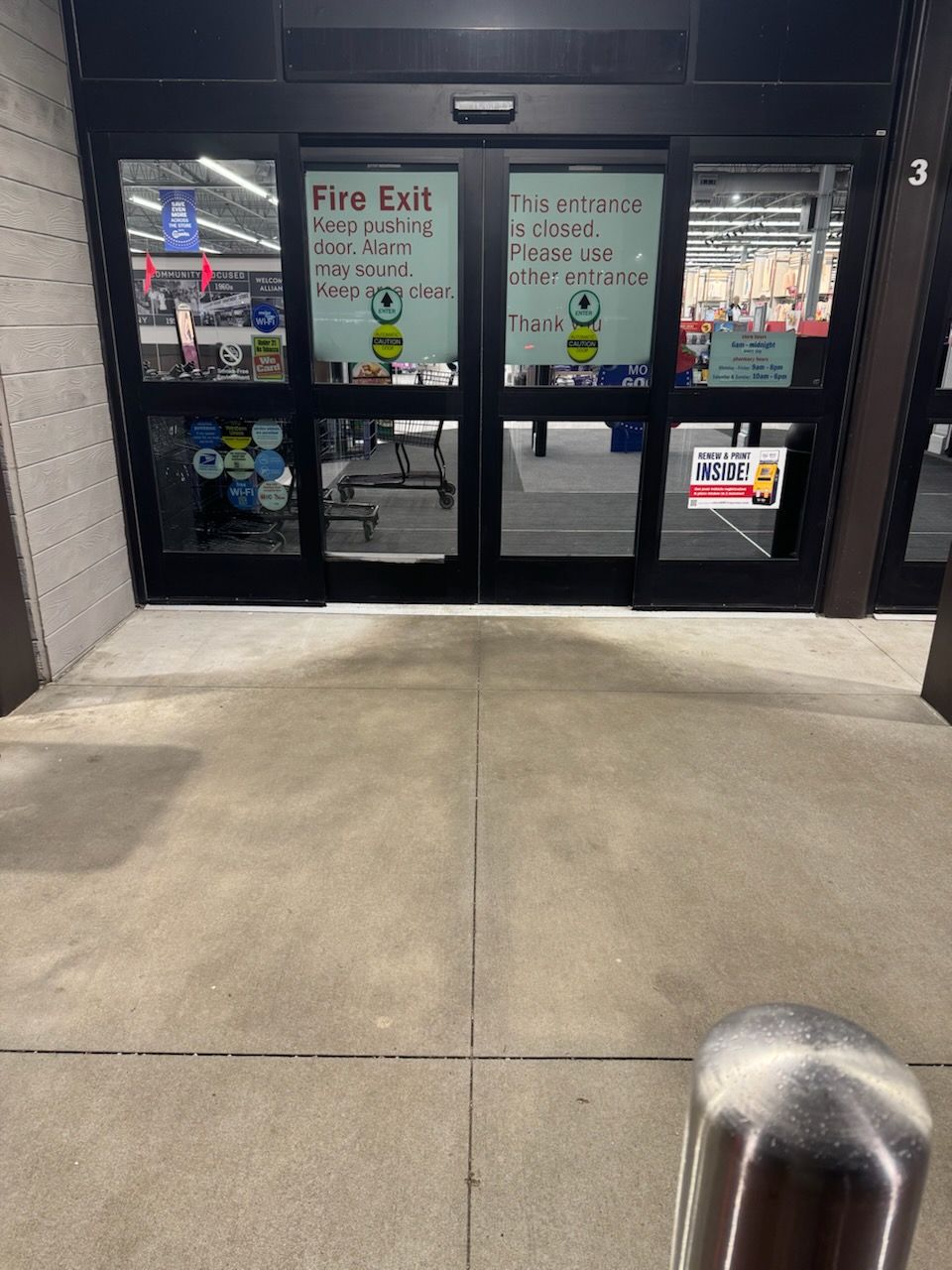 A white house with black shutters is sitting on top of a lush green hillside. | Louisville, Ohio | Mongiardo Power Wash