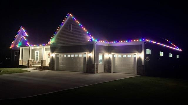 house that christmas lights on it is lit up — Louisville, OH — Mongiardo Power Wash