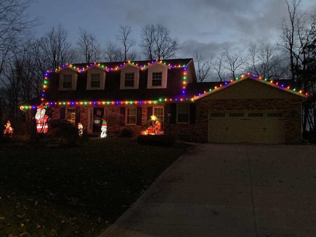 a house is decorated with christmas lights and decorations — Louisville, OH — Mongiardo Power Wash