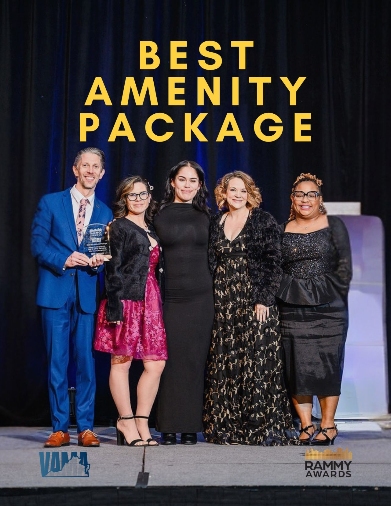 staff posing for community of the year award win