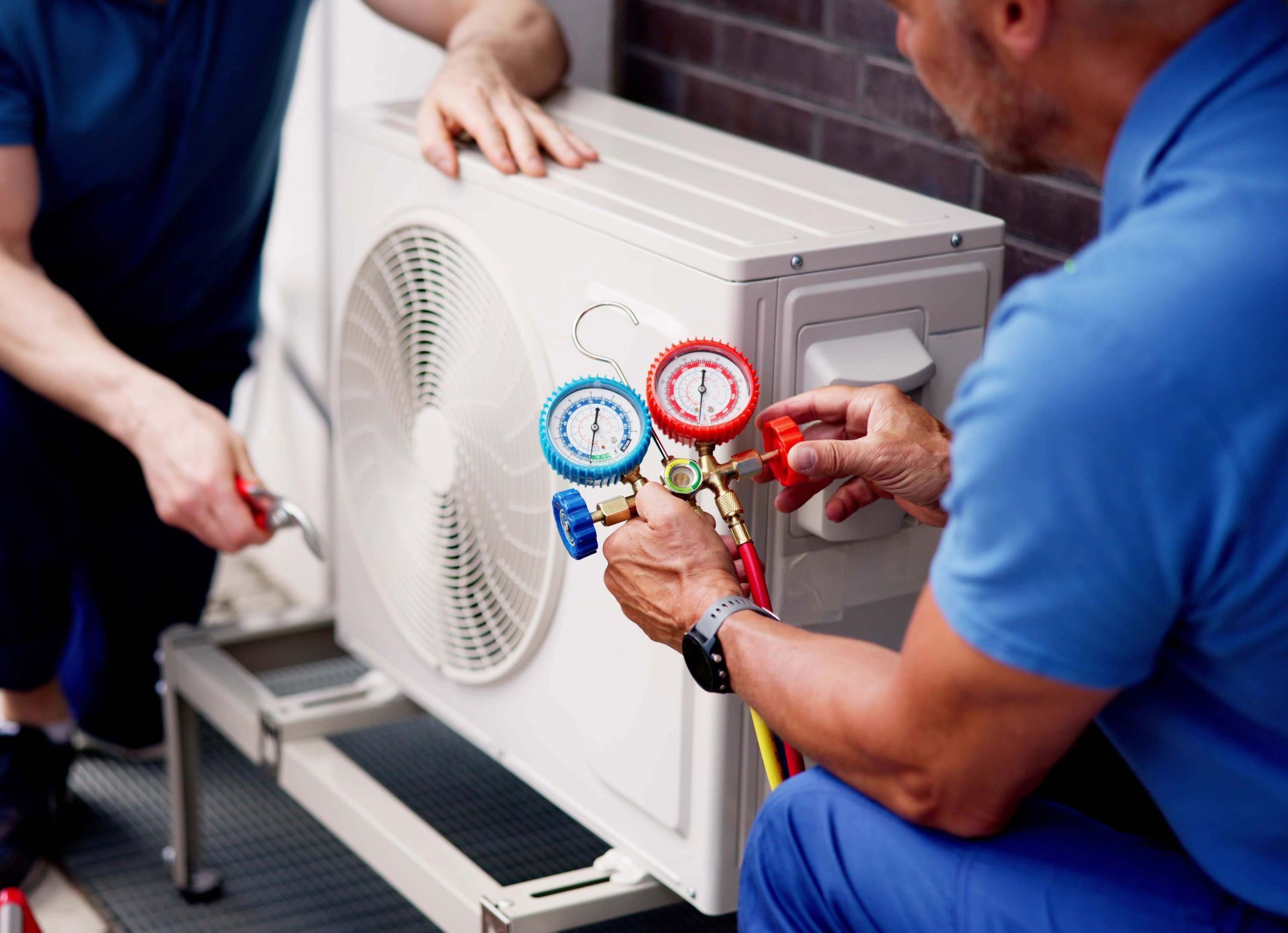 Experienced HVAC technician inspecting commercial building.
