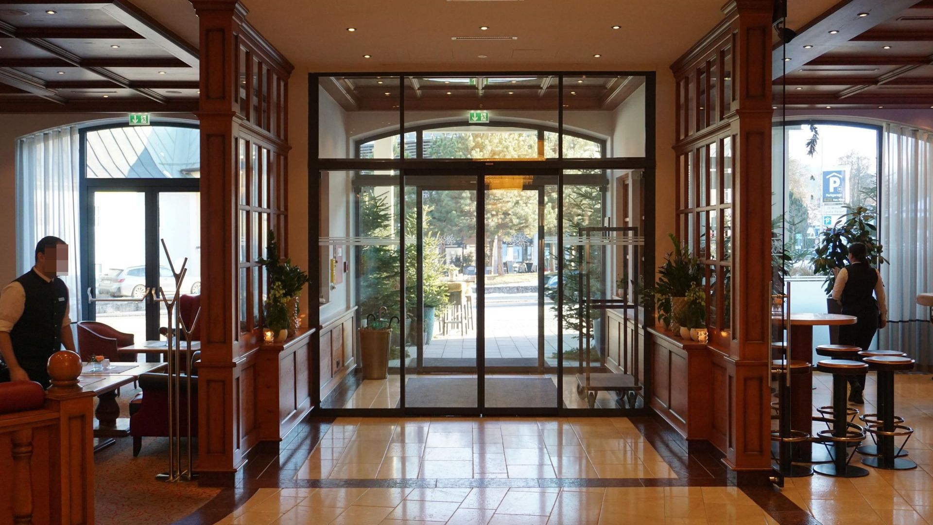 A hotel lobby with a sliding glass door