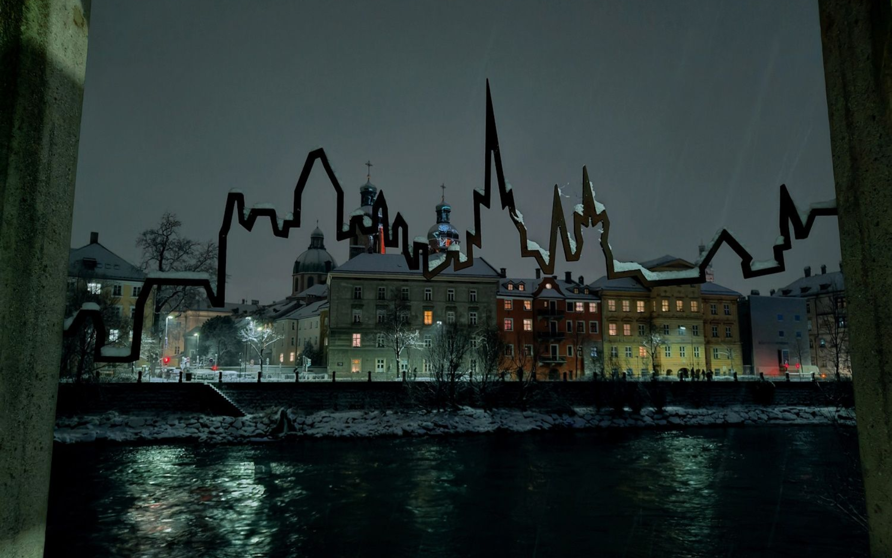 Night view of a snow-covered city skyline with pixelated overlay, buildings reflect in the dark river below.