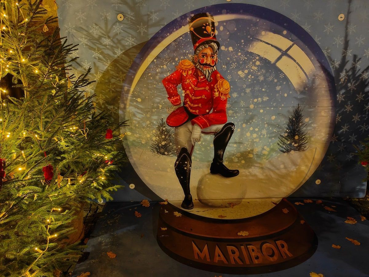 Maribor Christmas Nutcracker figure in a snow globe, labeled