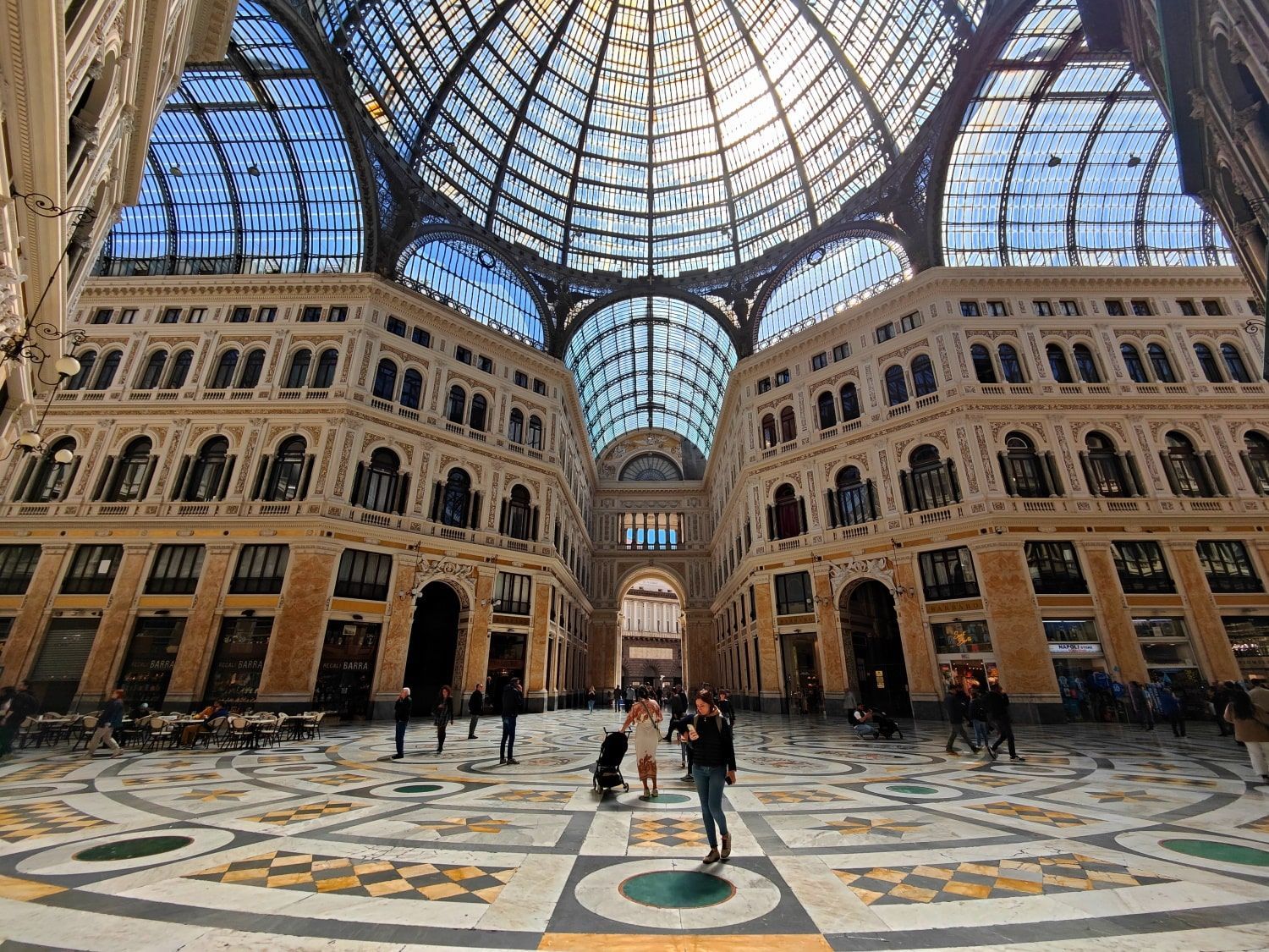 A very large building with a glass dome roof