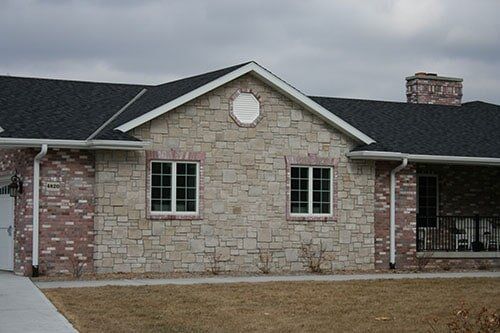 Brick home with stonework - residential masonry contractor in Columbus, NE