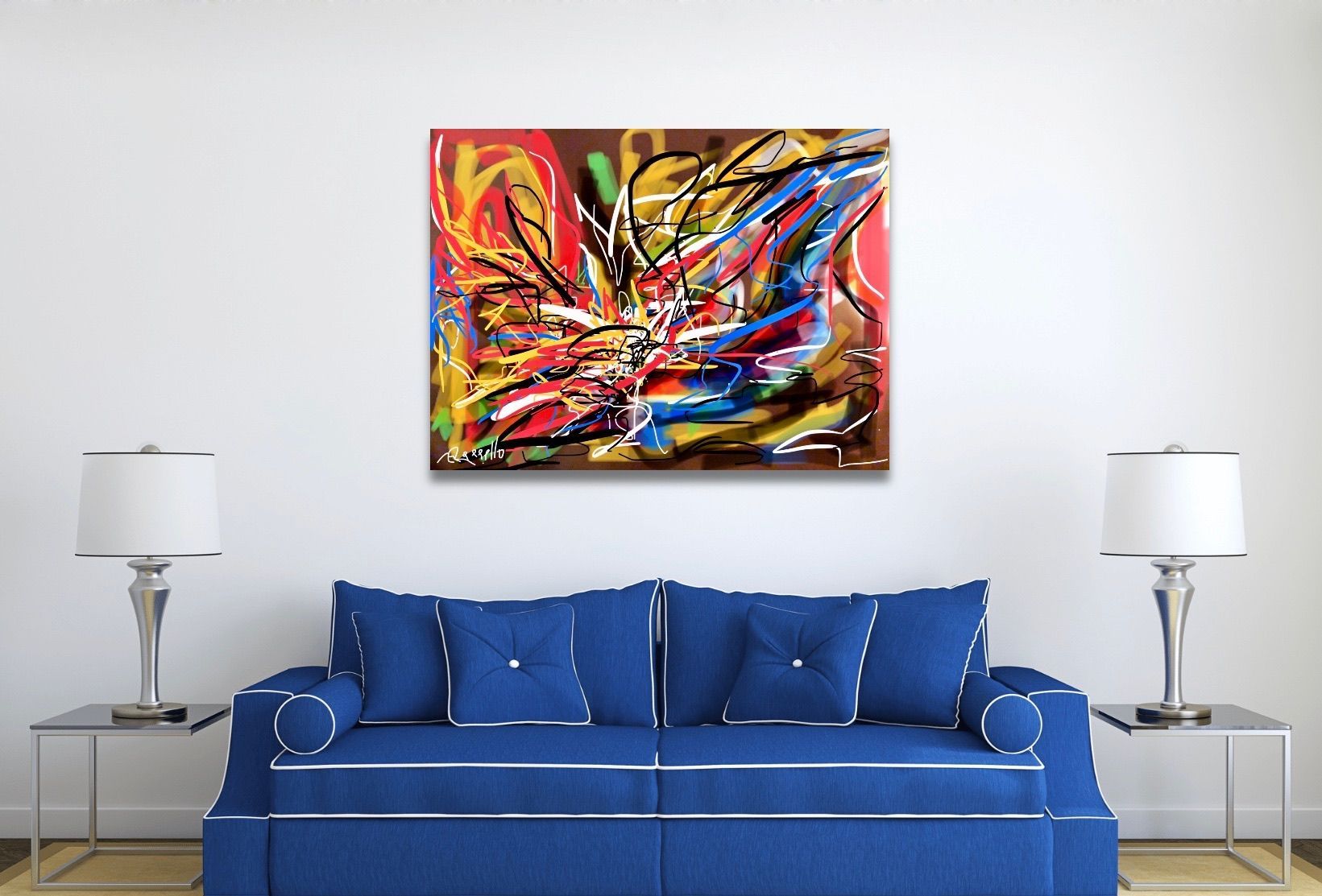 A living room with a blue couch and a painting on the wall