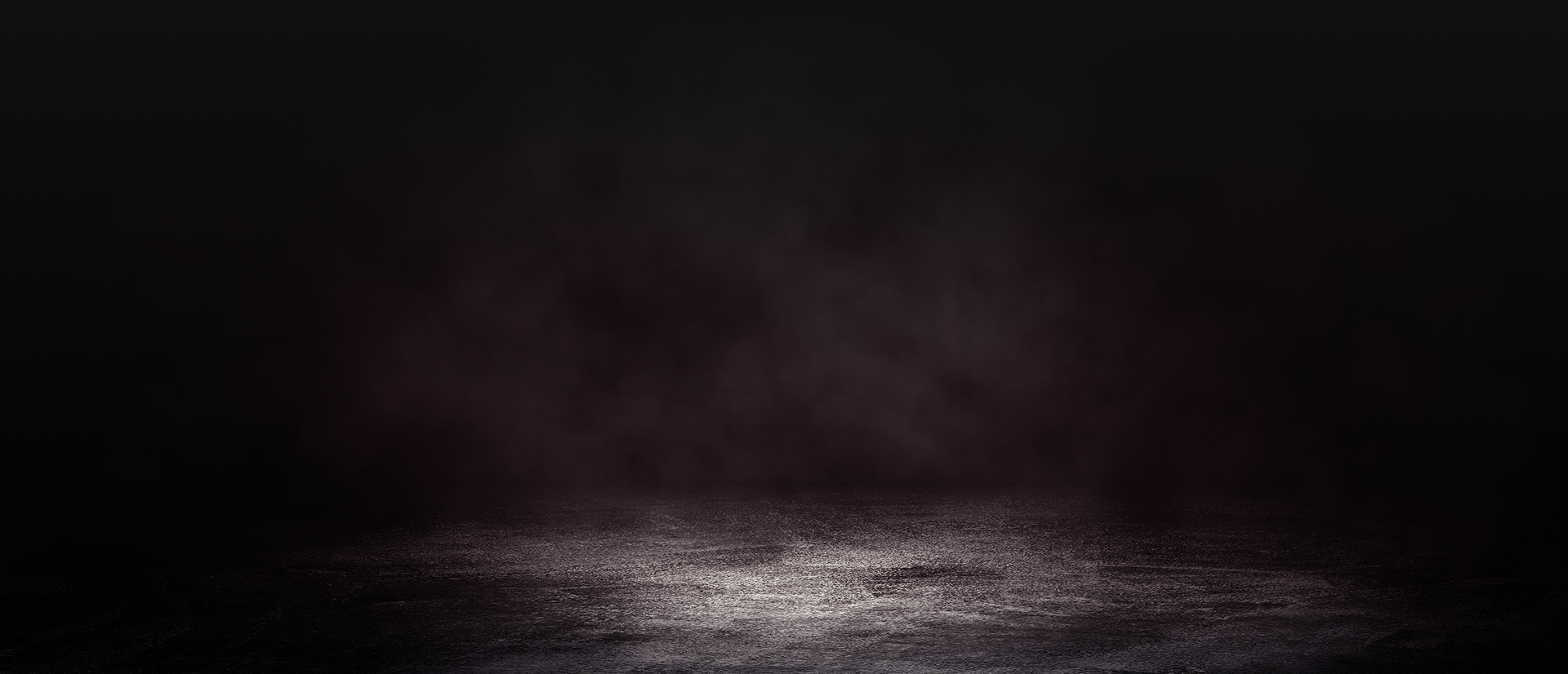 Dark, smoky backdrop. A textured, illuminated floor contrasts against the shadowy upper area. | Destiny Vehicle Solutions