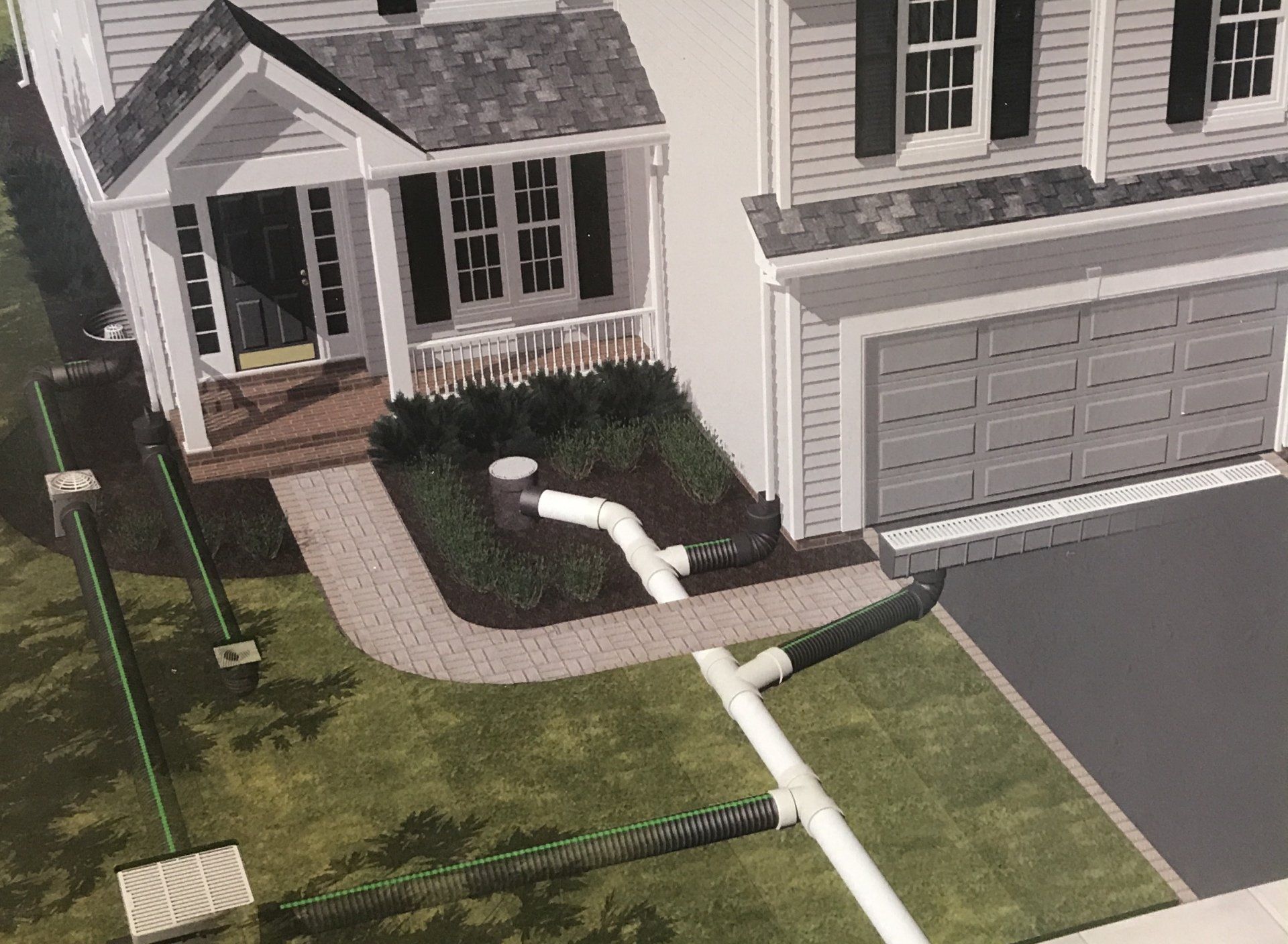 An aerial view of a white house with black shutters