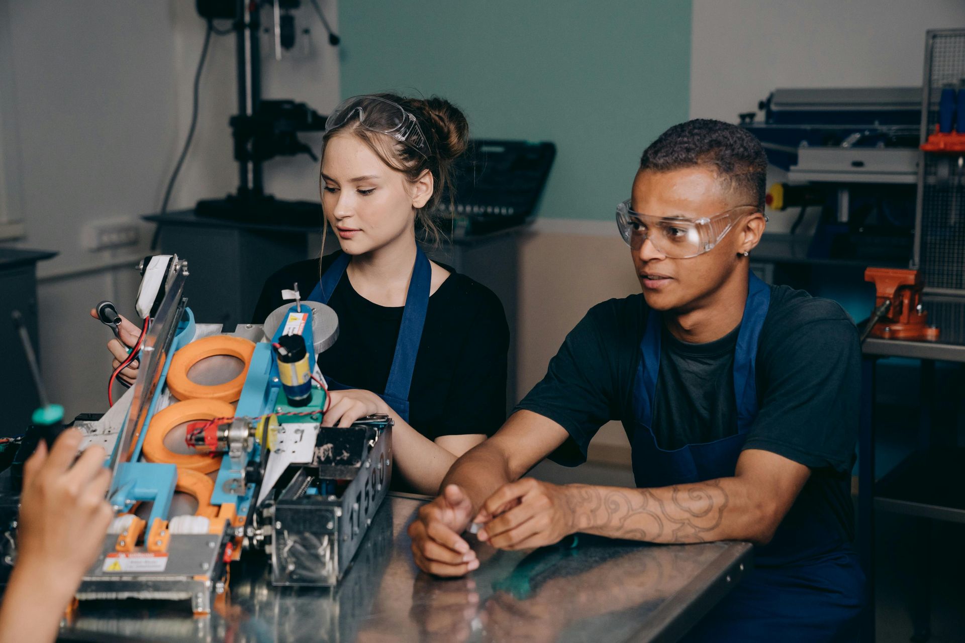 Engineering students at a table with equipment