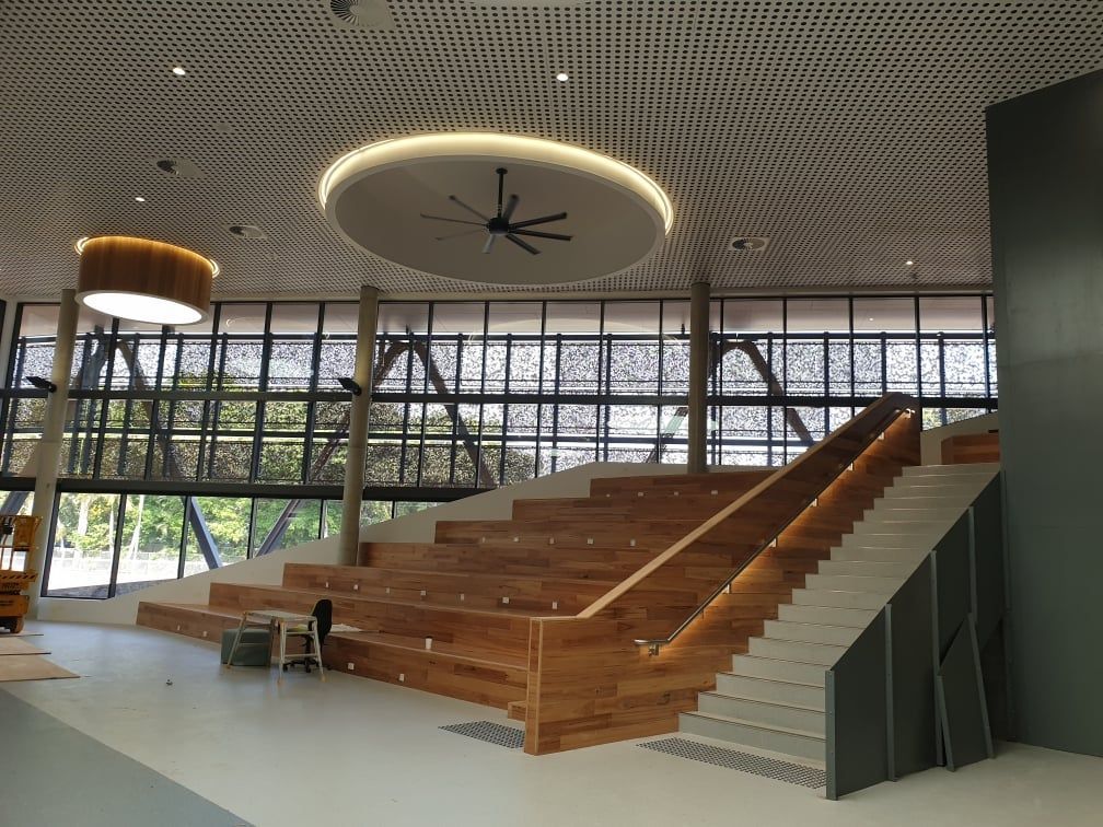 A Large Building With Stairs And A Clock On The Ceiling — Waltlec Industries In Garbutt, QLD