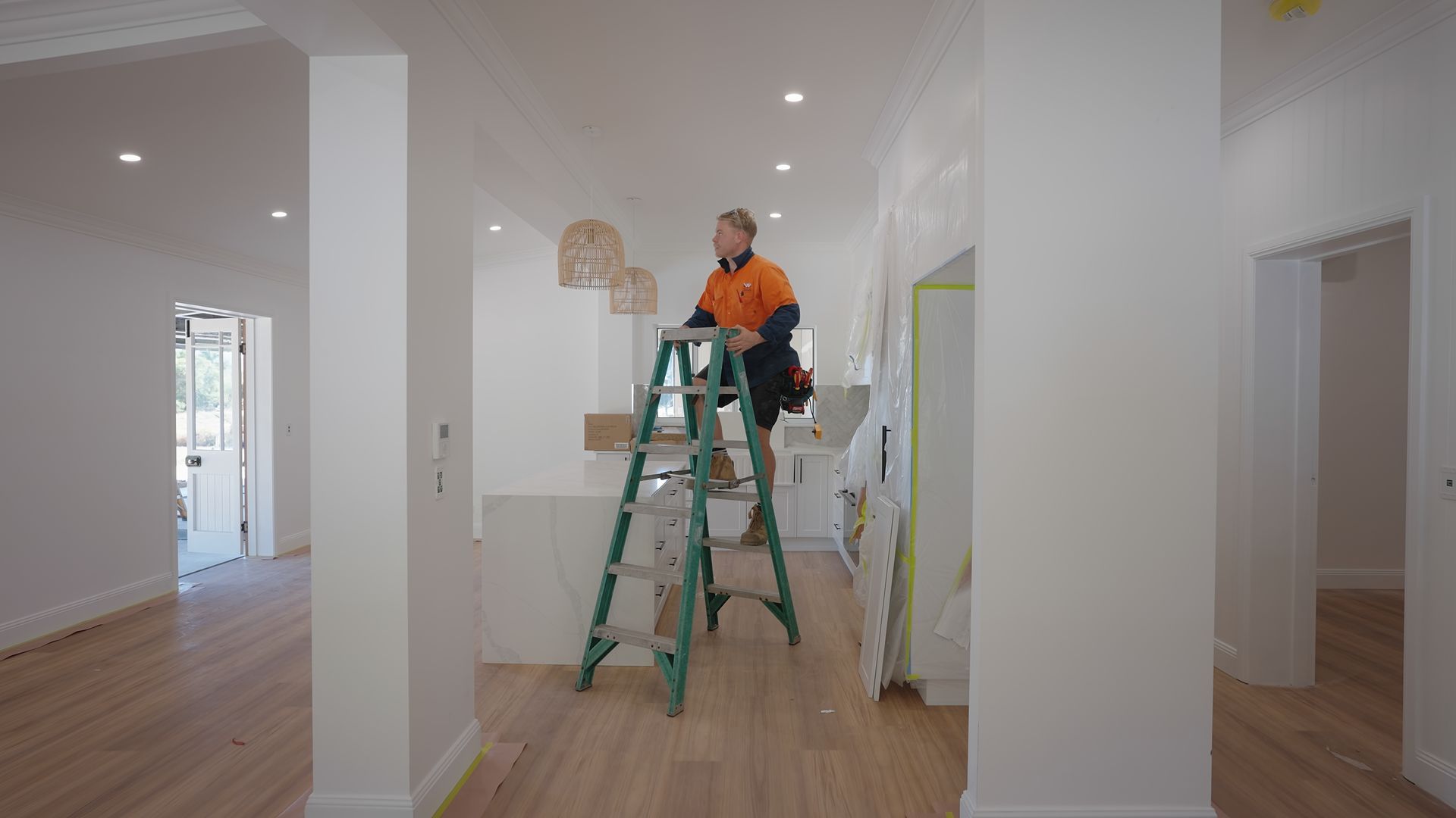 Man on a ladder — Waltlec Industries In Garbutt, QLD