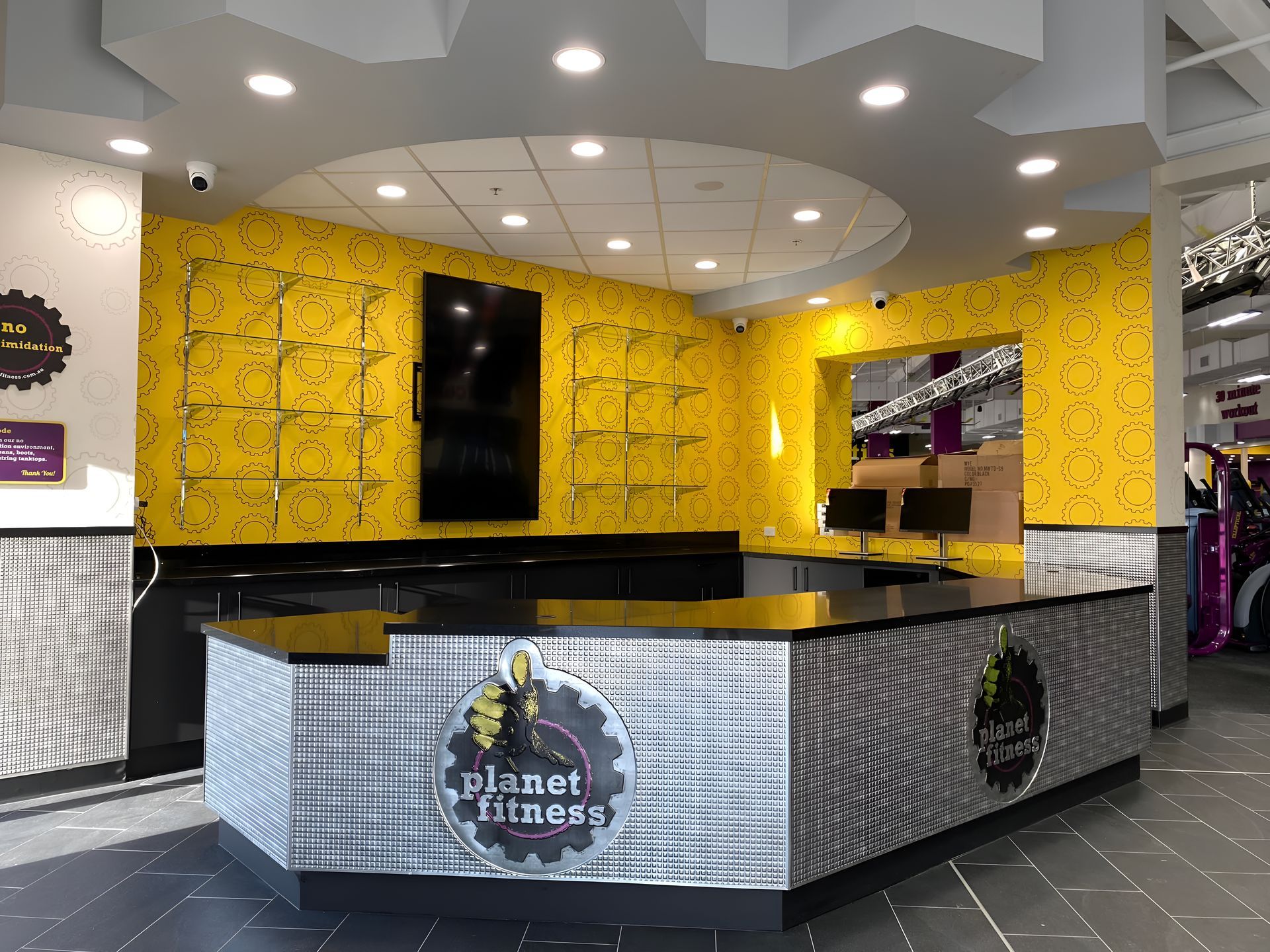 A Planet Fitness Reception Desk In A Gym With Yellow Walls  — Waltlec Industries In Garbutt, QLD