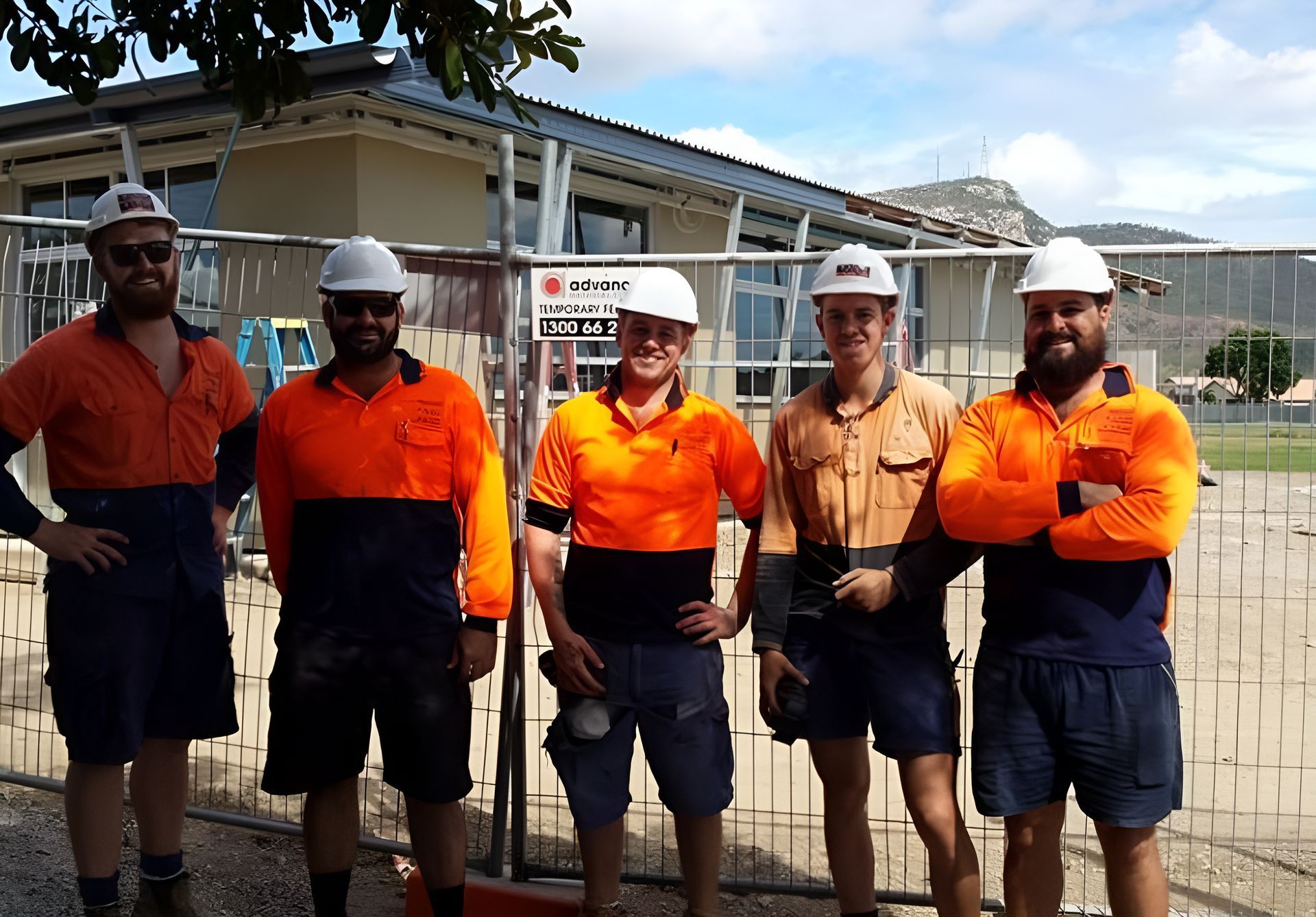 A Group Of Construction Workers Are Posing For A Picture  — Waltlec Industries In Garbutt, QLD