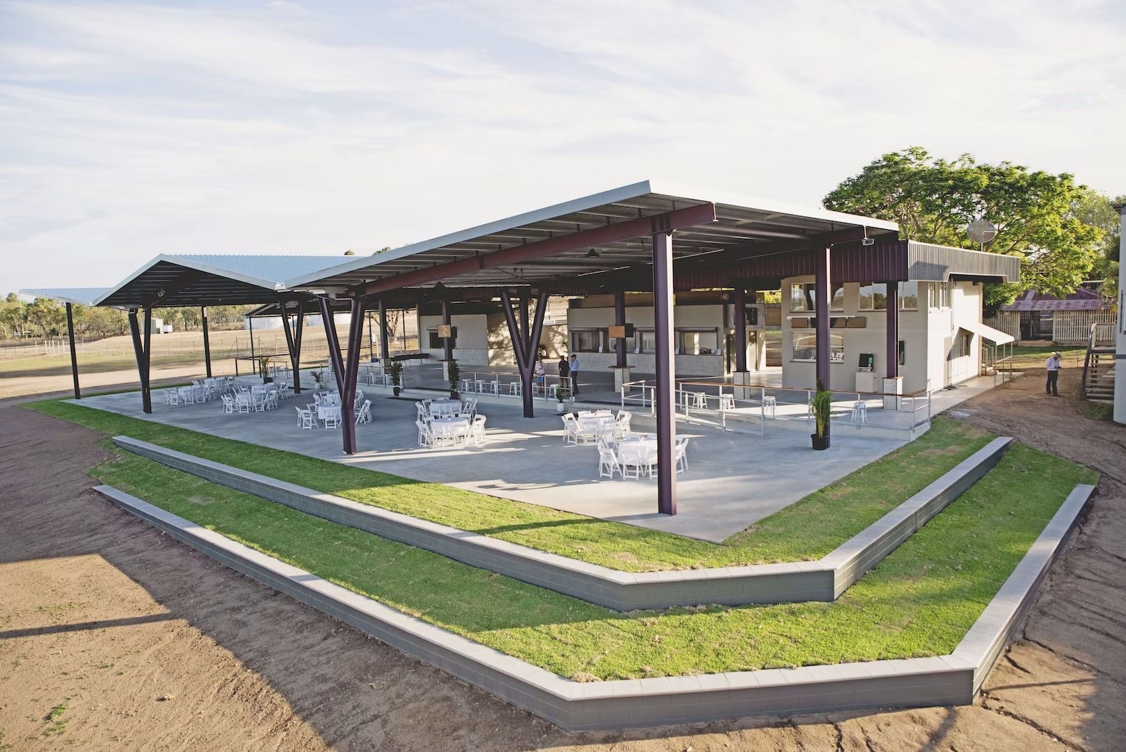 A Patio Area With Tables And Chairs Under A Canopy — Waltlec Industries In Garbutt, QLD