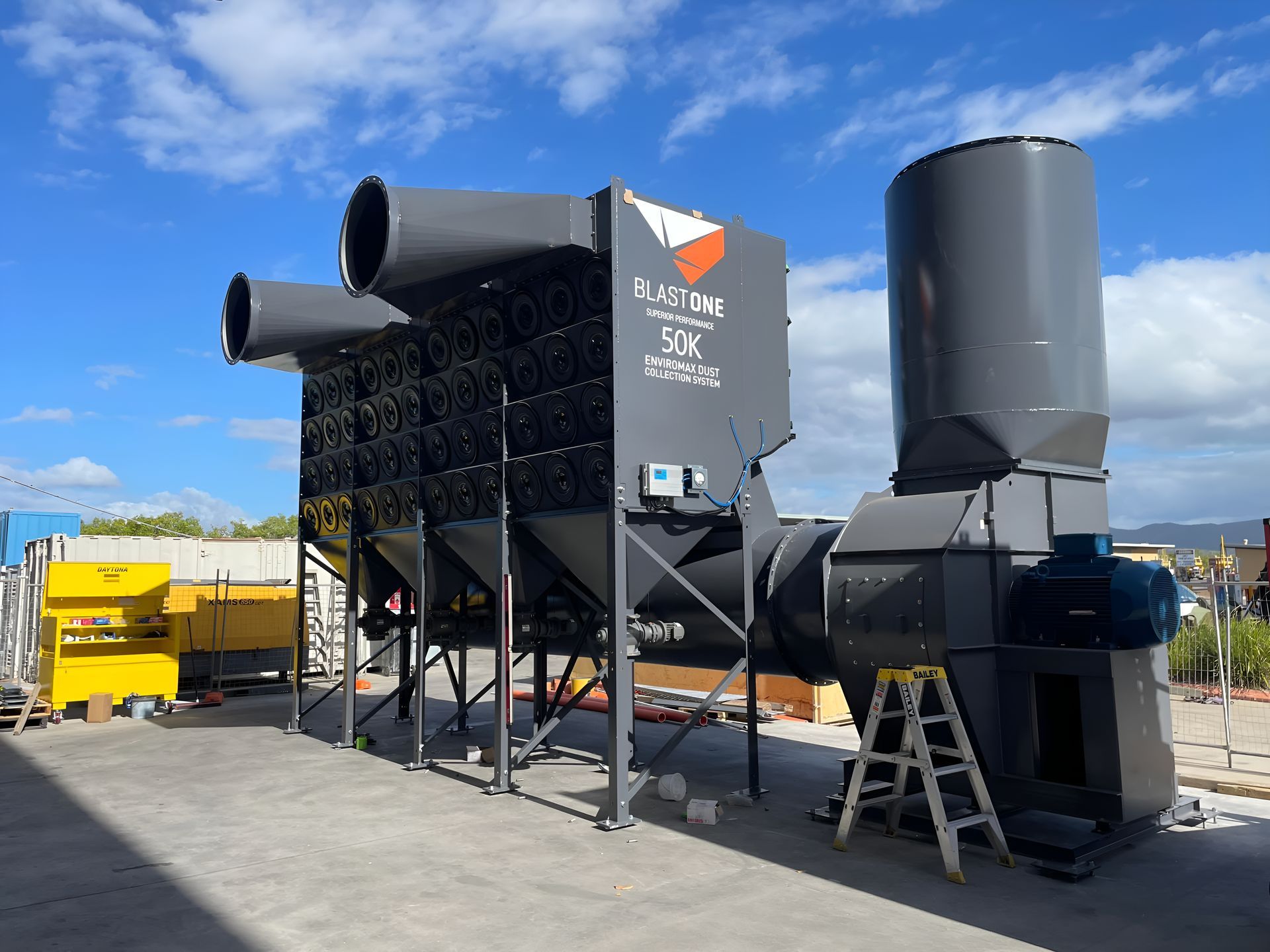 A Large Black Machine Is Sitting In A Parking Lot  — Waltlec Industries In Garbutt, QLD