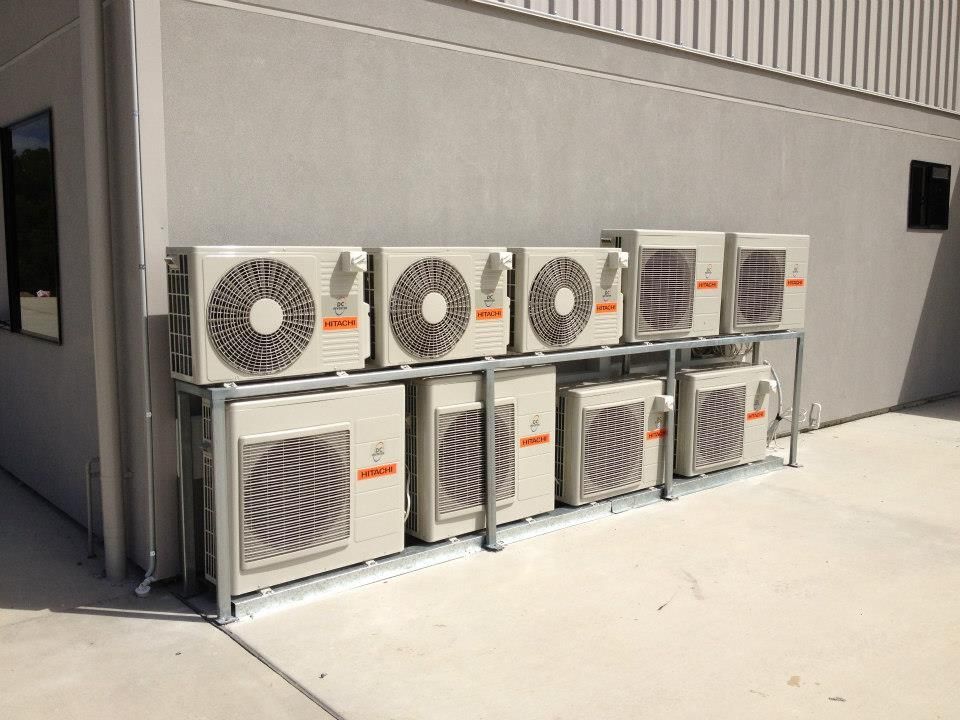 A Row Of Air Conditioners Are Lined Up Outside Of A Building  — Waltlec Industries In Garbutt, QLD