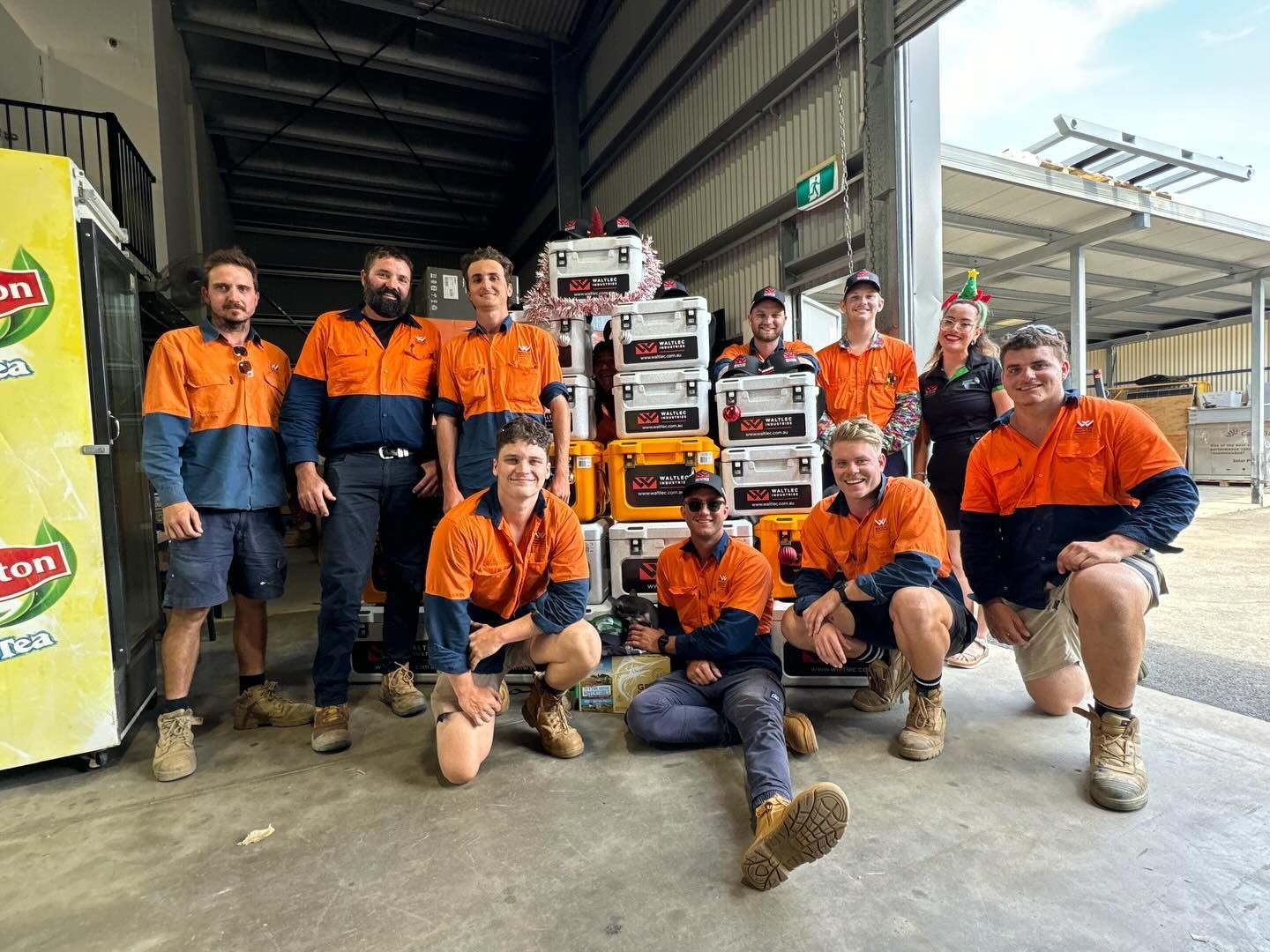 A Group Of People Are Posing For A Picture — Waltlec Industries In Garbutt, QLD