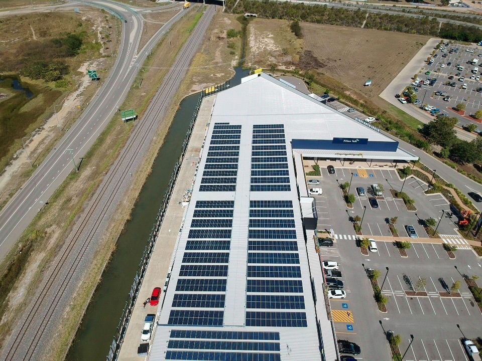 An Aerial View Of A Building With Solar Panels On The Roof  — Waltlec Industries In Garbutt, QLD