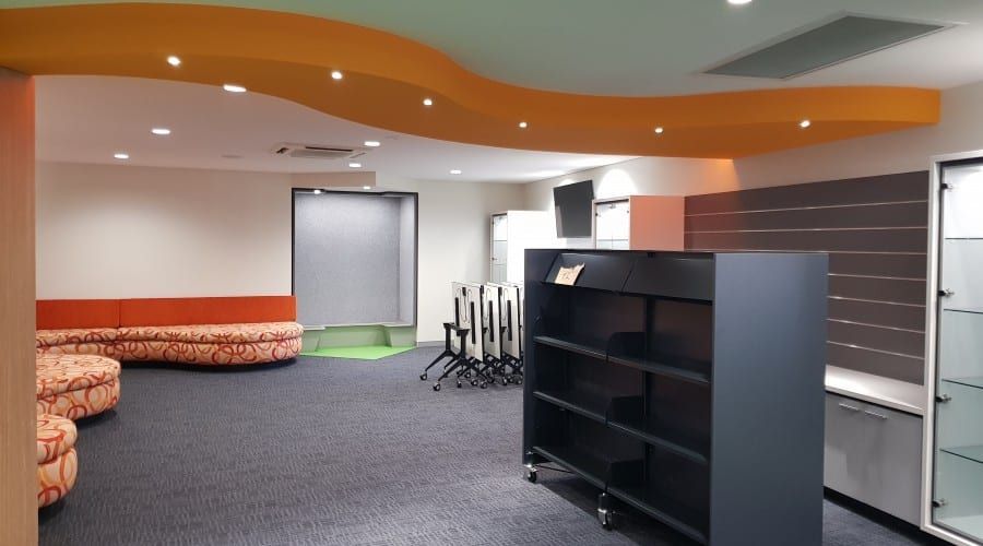 An Empty Room with A Shelf and A Projector Screen — Waltlec Industries In Garbutt, QLD