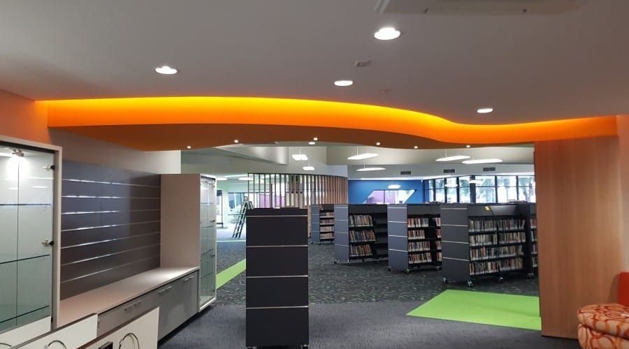 A Library with A Curved Ceiling and Lots of Shelves — Waltlec Industries In Garbutt, QLD