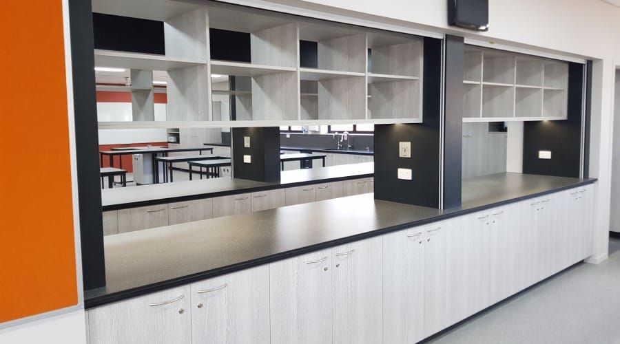 A Room with A Lot of Shelves and Tables in It — Waltlec Industries In Garbutt, QLD